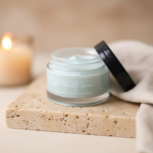 Jar of cream on a marble surface with a blurred background